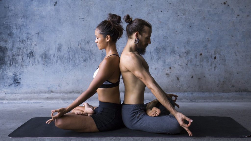 Strengthen emotional bonds while building trust with couples yoga